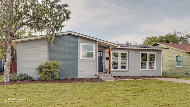 view of front of home with a front yard