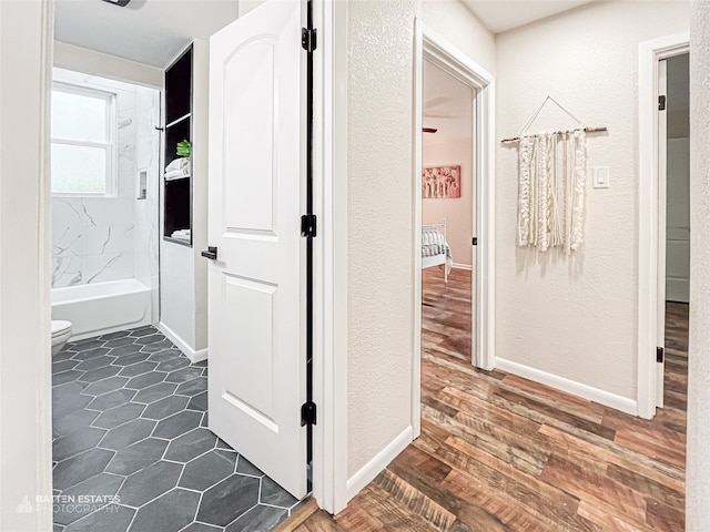 hall with dark hardwood / wood-style flooring