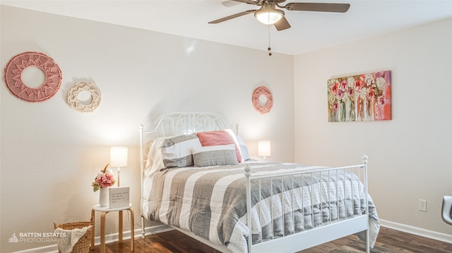 bedroom featuring ceiling fan and dark hardwood / wood-style floors