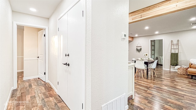 hall with wood-type flooring