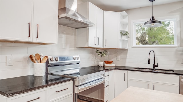 kitchen featuring white cabinetry, wall chimney exhaust hood, and stainless steel range with electric cooktop