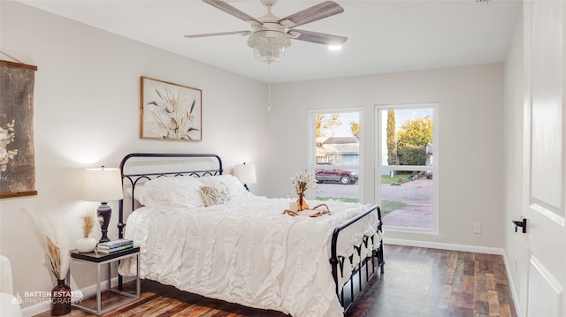 bedroom with ceiling fan and dark wood-type flooring