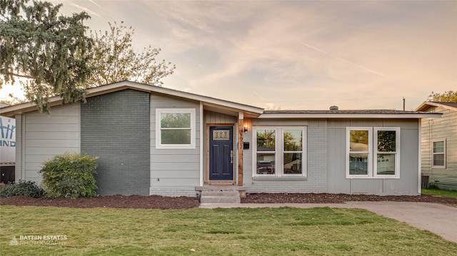 view of front of house with a lawn