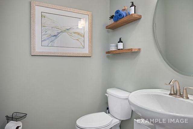 bathroom with toilet and sink