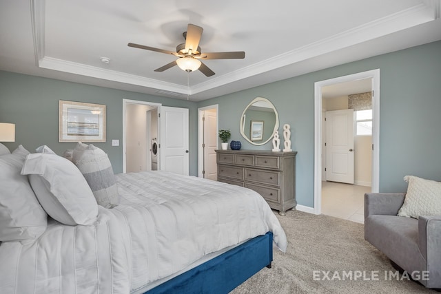 carpeted bedroom featuring a raised ceiling, ceiling fan, and ornamental molding