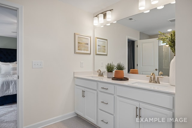 bathroom featuring tile patterned flooring and vanity