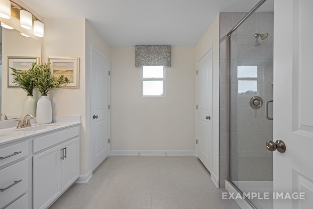 bathroom with vanity, tile patterned floors, and a shower with door