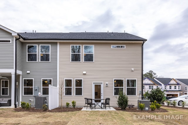 back of house with a patio and central AC unit