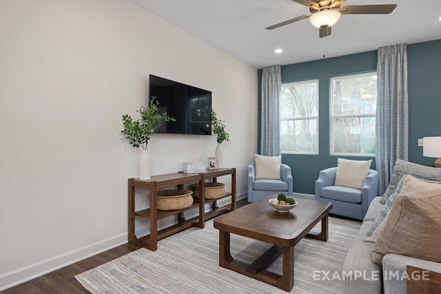 living room with hardwood / wood-style floors and ceiling fan