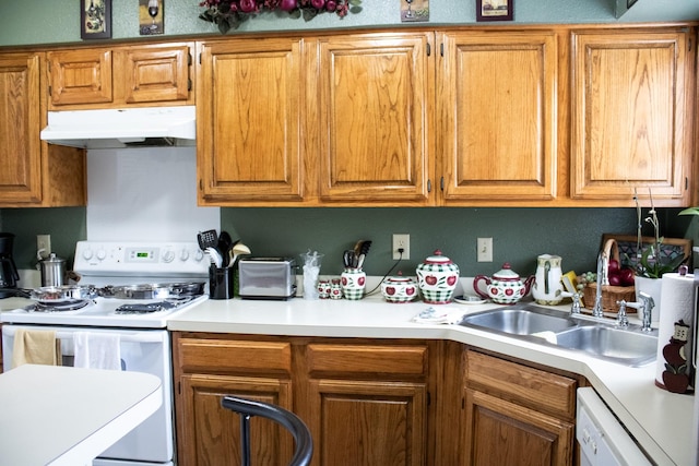 kitchen with sink and white appliances