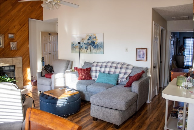 2010 Cloisters Dr Unit 2321, Arlington, TX 76011 - living area with a ceiling fan, wood walls, wood finished floors, and a tile fireplace