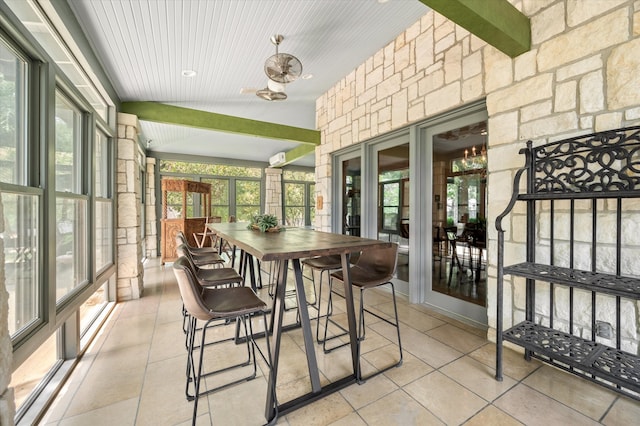 sunroom / solarium featuring wood ceiling and beamed ceiling