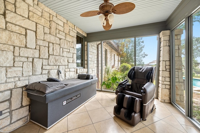 sunroom / solarium with ceiling fan