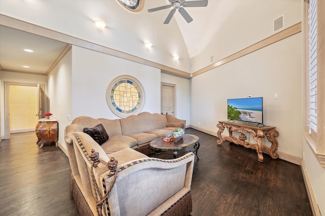 living room featuring crown molding, lofted ceiling, dark hardwood / wood-style floors, and ceiling fan