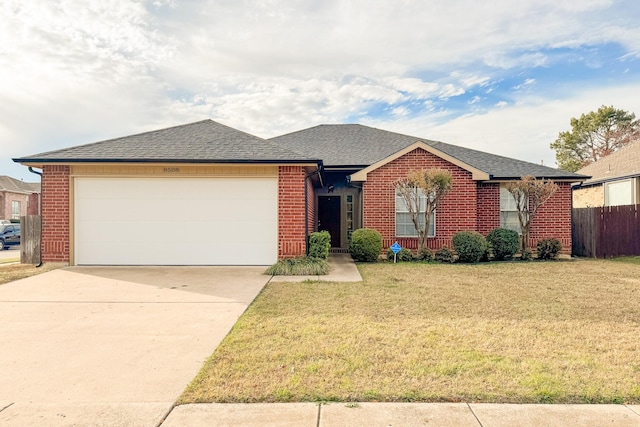 ranch-style house with a garage and a front lawn