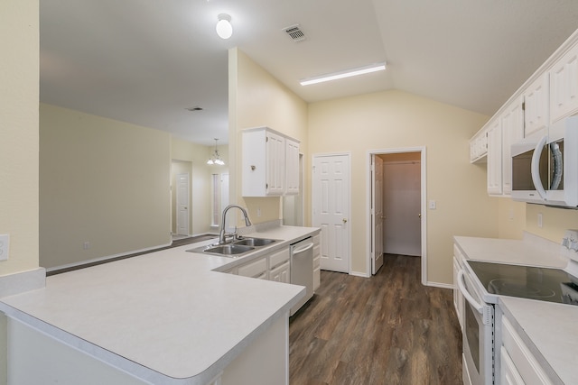 kitchen featuring sink, white appliances, white cabinetry, dark hardwood / wood-style floors, and vaulted ceiling