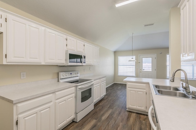 kitchen with white cabinetry, white appliances, sink, and hanging light fixtures