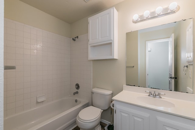 full bathroom featuring vanity, toilet, and tiled shower / bath