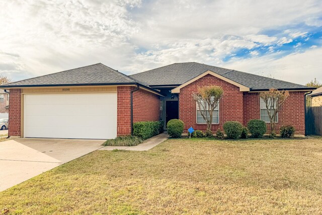 ranch-style home featuring a front yard and a garage