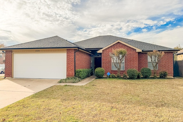 single story home with a garage and a front yard