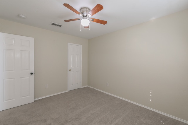 carpeted empty room with ceiling fan