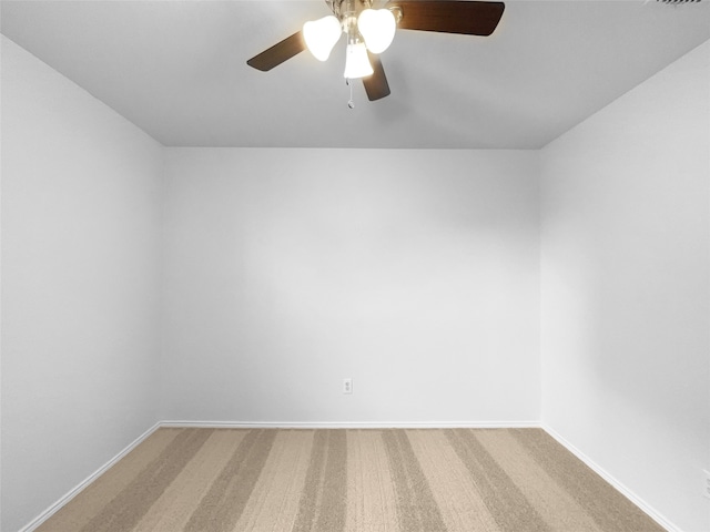 unfurnished room with carpet and ceiling fan