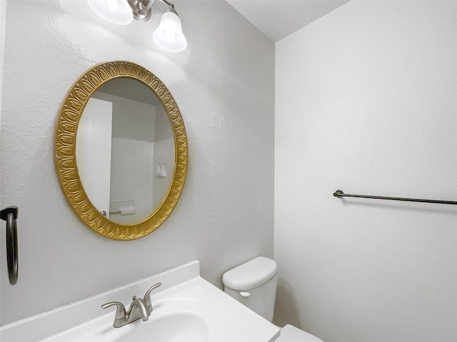 bathroom with sink and toilet