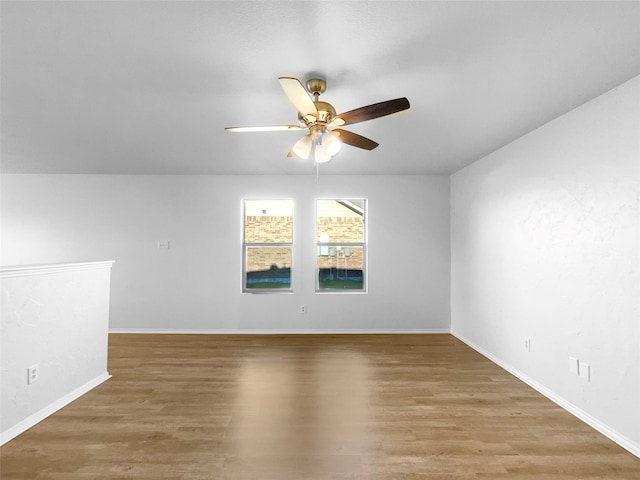 spare room featuring ceiling fan and hardwood / wood-style floors