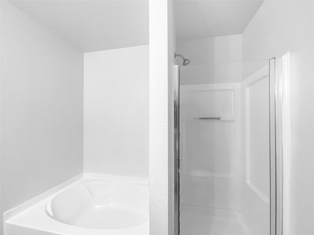 bathroom with shower with separate bathtub