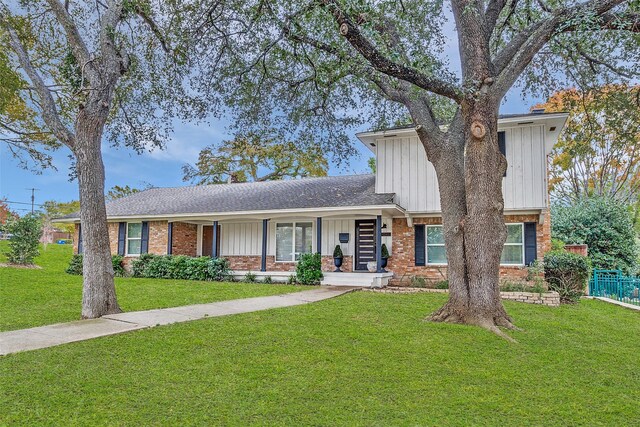 view of front of house with a front lawn and a porch