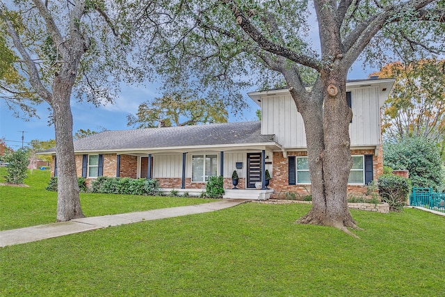 view of front of property with a front yard and covered porch