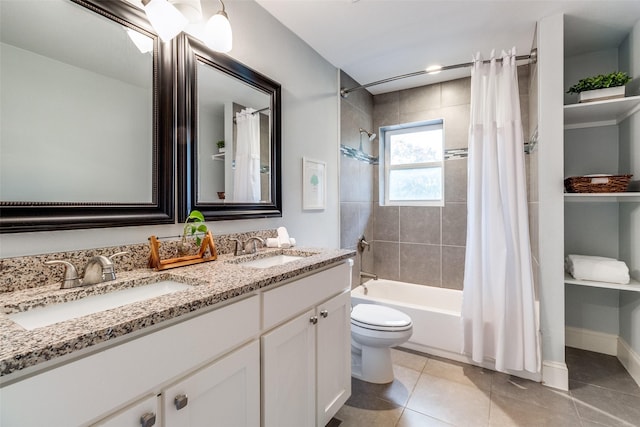 full bathroom featuring vanity, tile patterned floors, toilet, and shower / bath combo