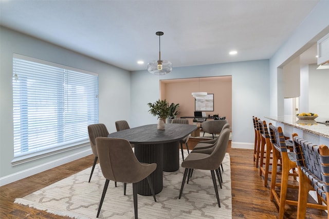 dining area featuring dark hardwood / wood-style flooring