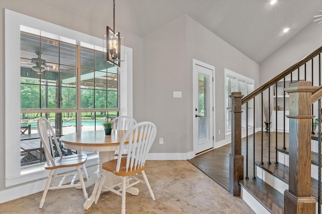 dining space featuring light hardwood / wood-style floors, plenty of natural light, and lofted ceiling