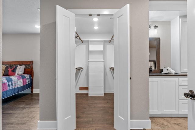 interior space featuring vanity and hardwood / wood-style flooring