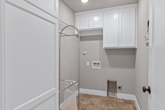 washroom with electric dryer hookup, cabinets, and washer hookup