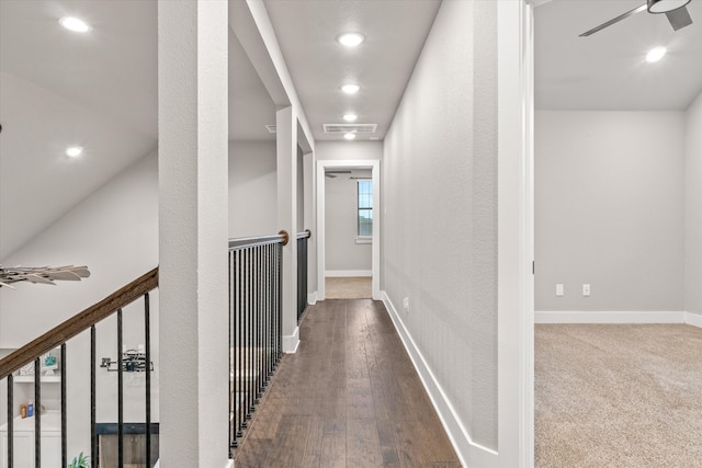 hall with hardwood / wood-style floors