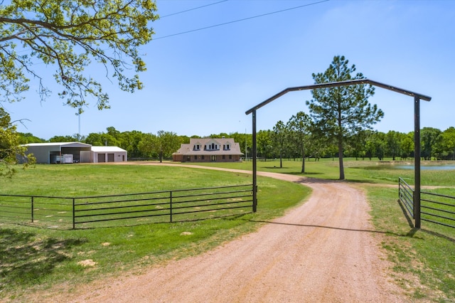 view of community featuring a rural view and a lawn