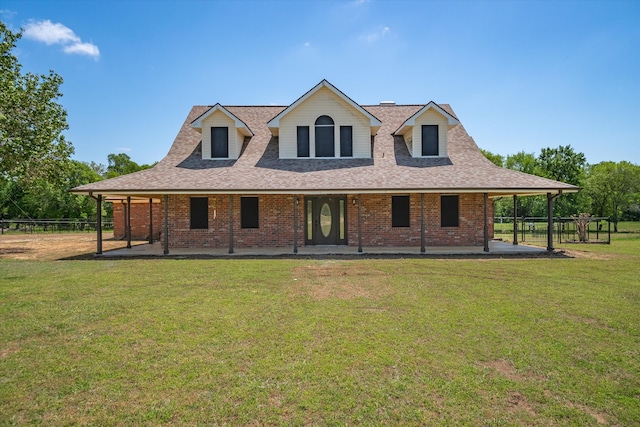 view of front facade with a patio and a front lawn