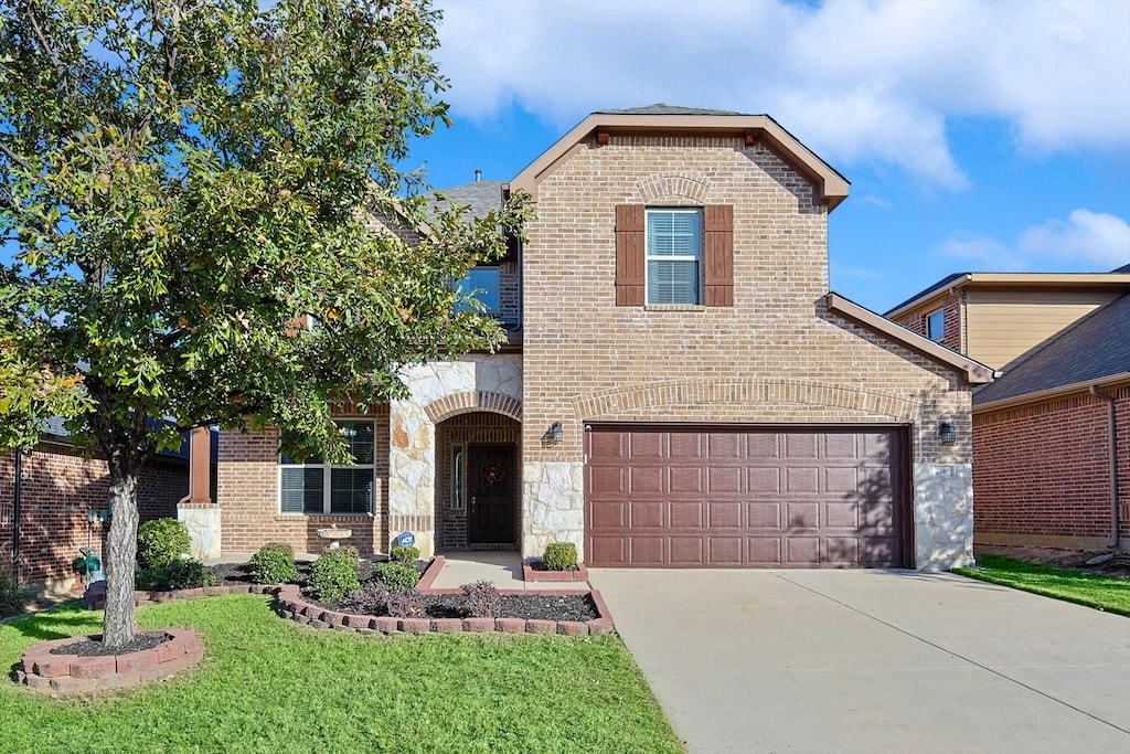 front of property with a garage and a front yard