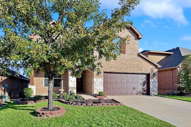 view of front of property featuring a garage and a front yard