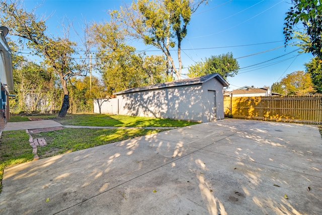 exterior space with an outbuilding and a lawn