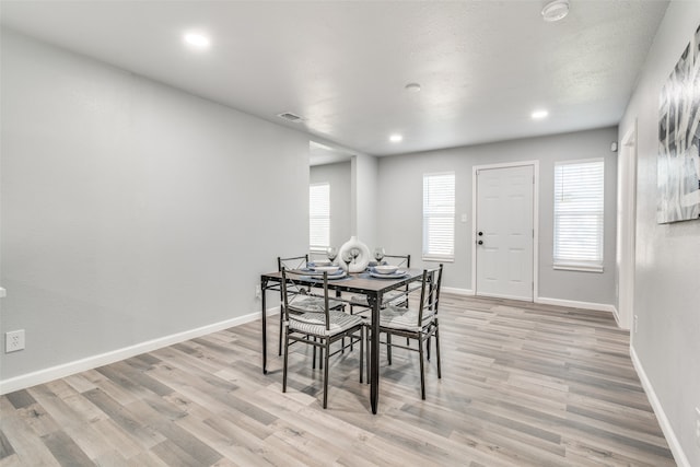 dining area with light wood-type flooring