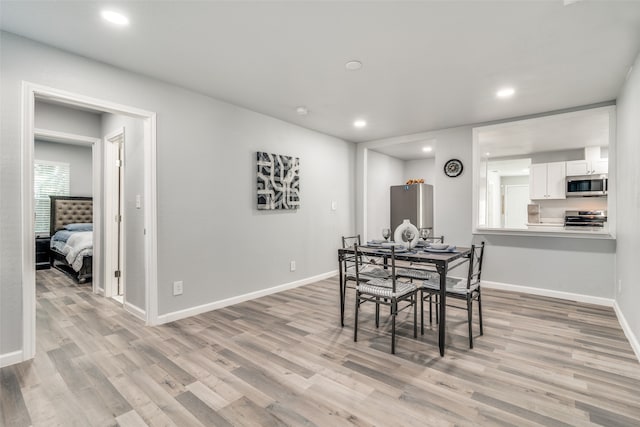 dining room featuring light hardwood / wood-style floors