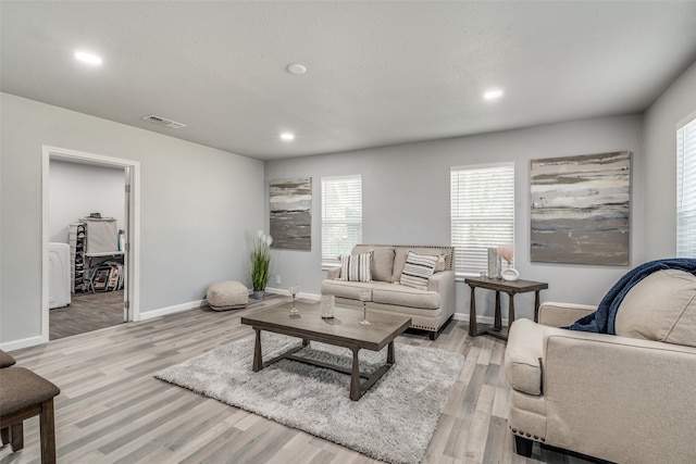 living room with light hardwood / wood-style floors