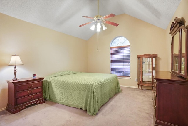 carpeted bedroom featuring a textured ceiling, ceiling fan, and lofted ceiling