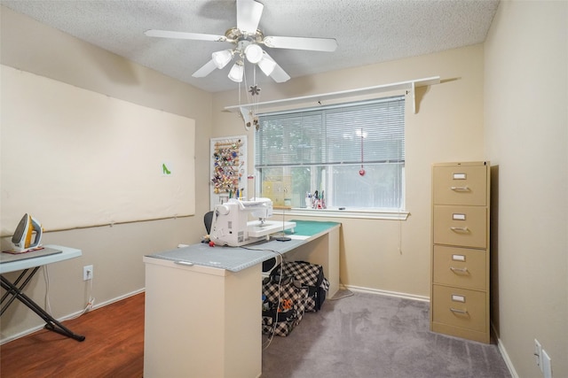 office with ceiling fan, a textured ceiling, and light wood-type flooring