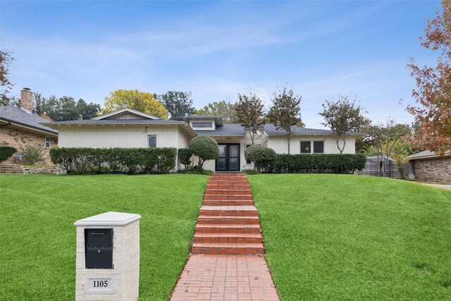 view of front of property with a front lawn