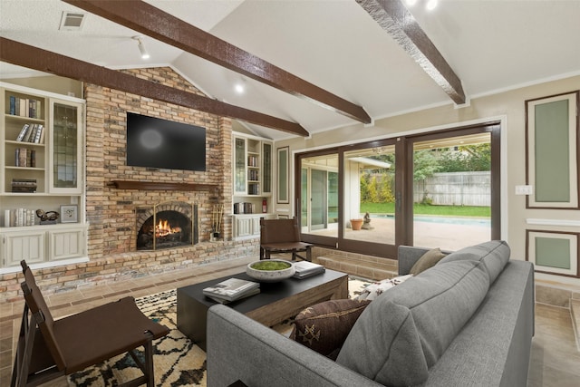 tiled living room with vaulted ceiling with beams, crown molding, a fireplace, and built in shelves