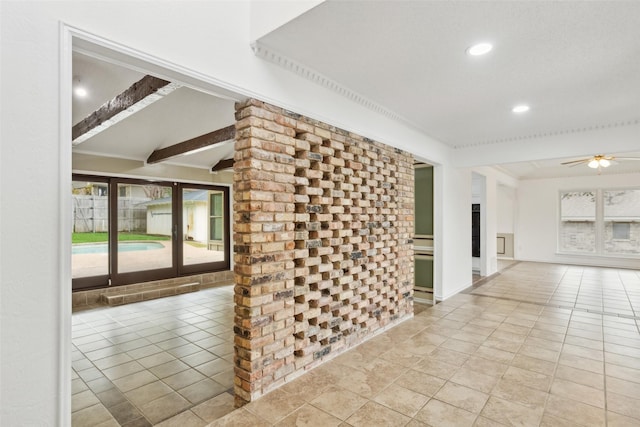 hall featuring beam ceiling and light tile patterned flooring